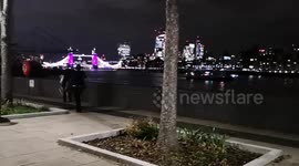 Near Tower Bridge, a married couple gets caught up as people queue to see the Queen Lying in state