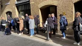 Huge queues continue in Shad Thames past Tower Bridge as people wait for hours to see The Queen’s coffin