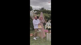 Family excitedly celebrates gender reveal of baby in beautifully decorated garden