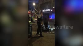 Shocking footage shows the scene just moments after two police officers were stabbed early this morning