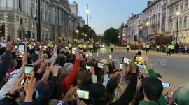 Onlookers get their phones out as Queen's children including King Charles III arrive at Parliament for lying in state vigil