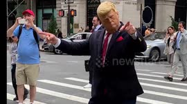 Street performer dressed as Trump wows crowd near NYC's Trump Tower