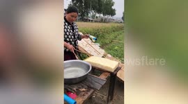 Resourceful Burmese vendor uses improvised slicer to cut thin sheets from tofu block