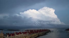 Incredible thunderstorm with lightning behind the clouds and in the sea (4K video)