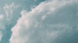 The beautiful blue sky and white clouds make me happy
