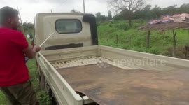 Children stumble upon snake while playing on back of trolley in central India