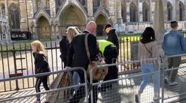 Women gets removed from Her Majesty Elizabeth mourning que outside Westminster Abby