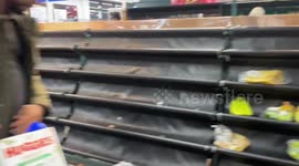 Empty shelves and long queues in London as 'panic buyers' prepare for store closures for Queen’s funeral tomorrow
