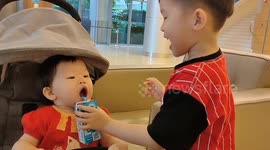 Baby sister epic reactions after being given pack of milk by her elder brother