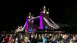 Amazing scene: people zig-zag through barriers near iconic Tower Bridge as part of the Lying In State queue