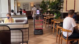 Robots serve customers at restaurant chain in Bangkok