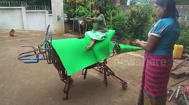 Burmese blacksmith builds moving triceratops robot in his workshop