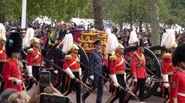 Royals follow Queen's funeral procession through the streets of London