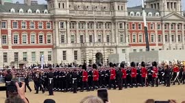 The Queen’s coffin pulled by Royal Navy Sailors with Royal family behind on Horse Guards Parade