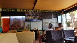 Holiday makers in Menorca watch the Queen's Funeral live in Irish Bar