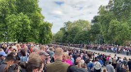 Thousands of people wait for the Royal hearse next to Albert Memorial during The Queen’s state funeral