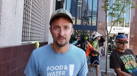 The Protester speaks on climate and environmental justice at the New Jersey Transit headquarters