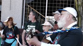 Demonstrators participate in a rally for climate and environmental justice at the New Jersey Transit headquarters i