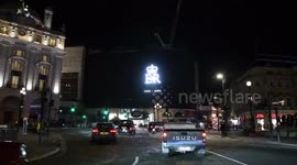 Piccadilly Circus in the West End of London pays tribute to the Queen. With the added darkness this makes for a dark and sombre video