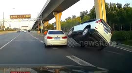 BMW's sudden lane change causes vehicle to mount it in China