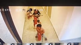 Children caught on camera spraying fire extinguishers around residential building in China