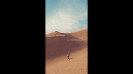 Athlete glides down stunning sand dunes of Chile's Atacama Desert