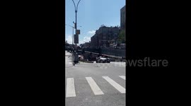 Crane collapses on car in Bronx, New York, driver survives