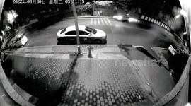 Car skidding high-speed across road in China narrowly misses pedestrians
