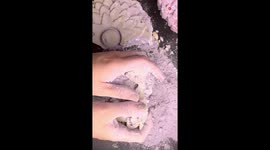 Destructive ASMR as creator crumbles chalk in satisfying footage