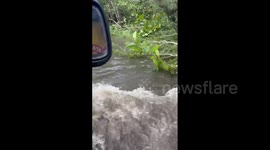 Driving through flooded roads in Puerto Rico as towns remain underwater