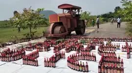 Boozedozer: Police in southern India destroy illicit liquor using bulldozer