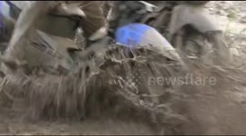 Motorbike racing in the mud is as fun and sloppy as you may think it is