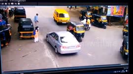 Miraculously survives  Seven people by Speeding a car on a busy road in western India