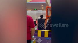 Turbulent winds lash mall's rooftop during storm in the Philippines
