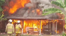 Fire burns through residents' homes in Indonesia after explosion sparks blaze