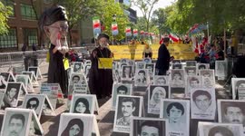 Pictures of executed political prisoners and puppet of Ebrahim Raisi at protest in New York