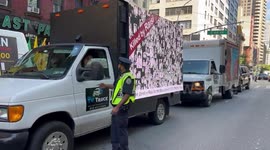 Trucks with electronic signs at protest against Ebrahim Raisi in NYC, USA
