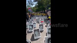 Exposition showing victims of Raisi’s regime at protest in NYC, USA