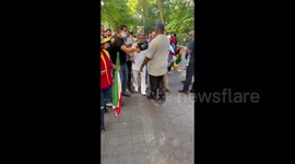 Dariush Eghbali, an Iranian myth singer, leaving rally against Ebrahim Raisi in NYC, USA