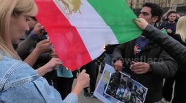Newsflare Edit - Iranian woman burns flag next to Churchill Statue in protest for Mahsa Amini