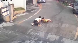 Chinese teenager catches 5-year-old skater speeding down slope toward traffic