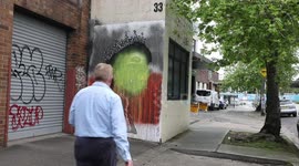 Mural to the Queen is painted over with Aboriginal flag, Sydney, Australia