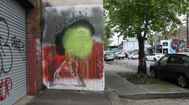 Mural to the Queen is painted over with Aboriginal flag, Sydney, Australia