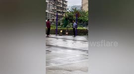 Woman swinging legs round and round whilst on pull-up bar in humorous footage
