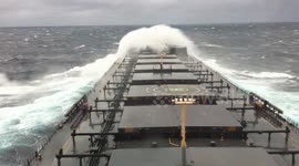 Capsized vessel gets hit by monstrous waves repeatedly in the Pacific Ocean