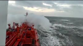 Bulk carrier ship faces a massive storm in the Atlantic Ocean