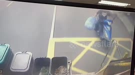 Rider carrying rubbish bags skids across road while chasing after garbage truck