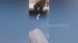 Angry woman kicks passenger's shoe out of train as she occupied 2 seats