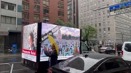 Trucks with electronic signs against Ebrahim Raisi driving through New York, USA