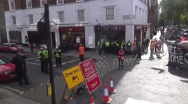 Antifa activists outside Home Office wait anti-migrant protester to arrive